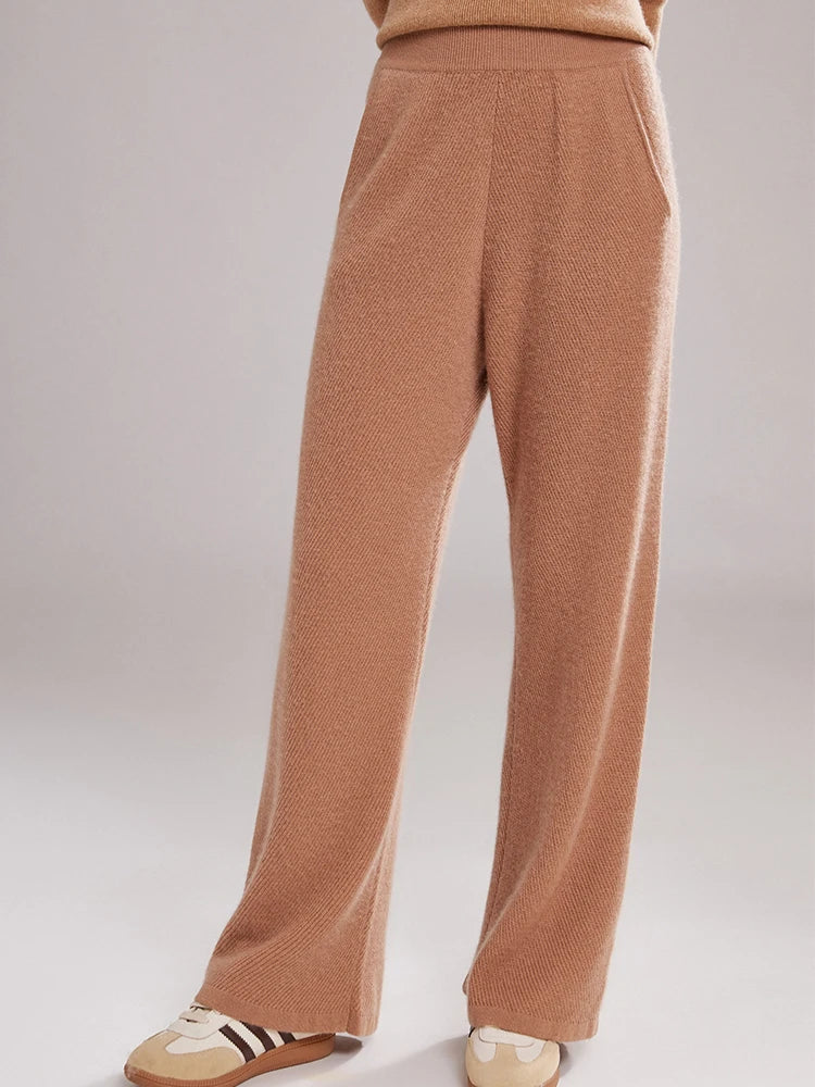 Model wearing Café Au Lait cashmere pants with soft diagonal drape – From Borcelleclothes.