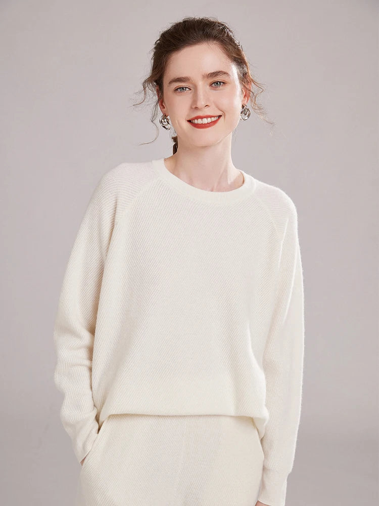 Model wearing White Coffee cashmere pants, hand resting in side pocket – From Borcelleclothes.