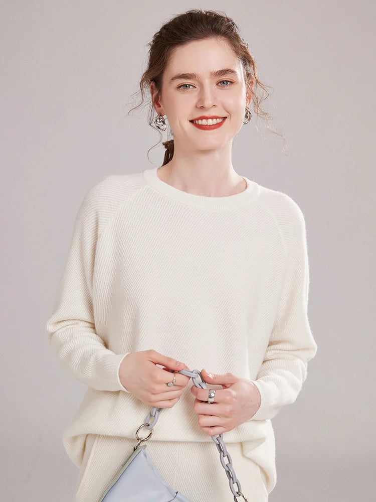 Model in White Coffee cashmere set, standing with a soft-toned handbag – From Borcelleclothes.