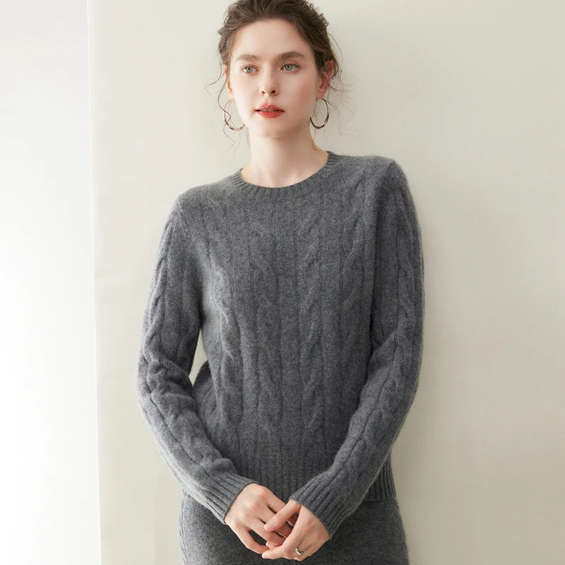 Women's cashmere set with two-strand cables in Davy Grey, model gently touching fingertips — From Borcelleclothes.