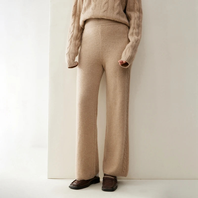 Women's cashmere set with two-strand cables in Pale Taupe, model wearing the pants — From Borcelleclothes.