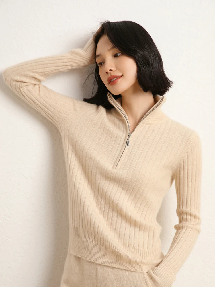 Model resting hand on head in cashmere sweater in shifting ribs, Almond — From Borcelleclothes.