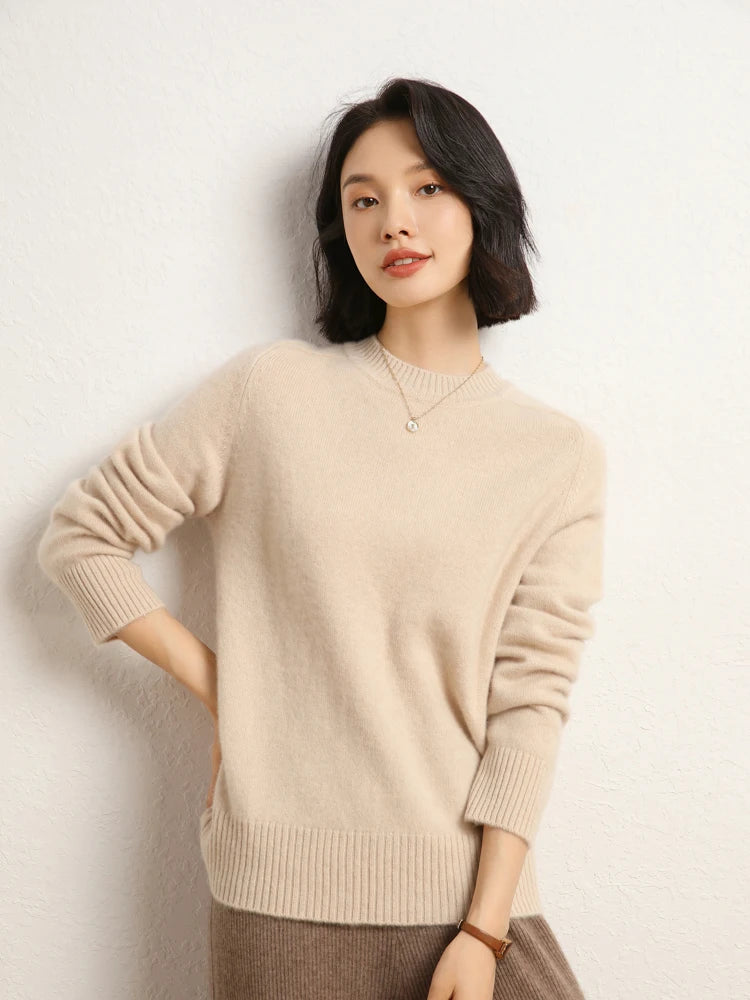 Woman in Almond cashmere sweater with hand on hip – From Borcelleclothes.