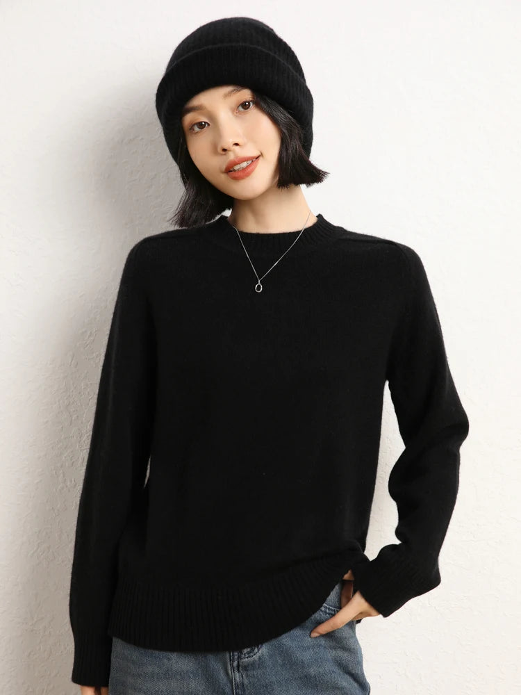 Woman in Onyx cashmere sweater with hand on hip – From Borcelleclothes.