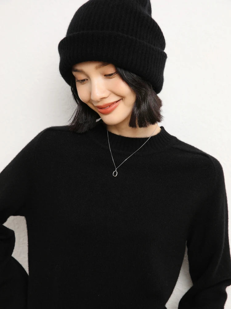 Woman in Onyx cashmere sweater styled with matching hat – From Borcelleclothes.