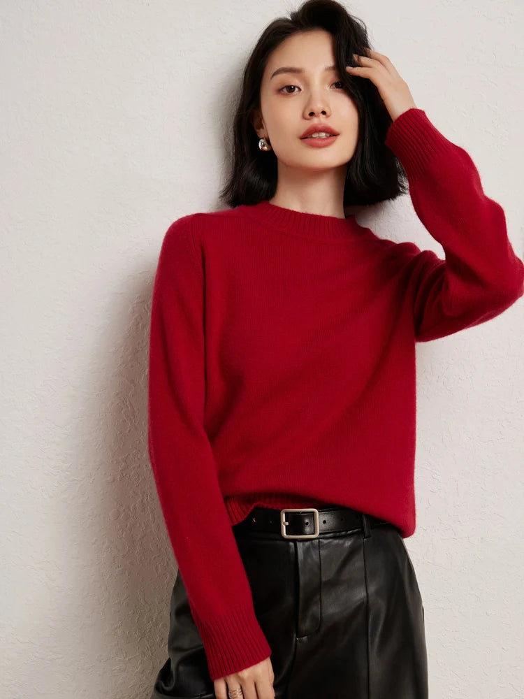 Woman in Red Devil cashmere sweater adjusting hair – From Borcelleclothes.