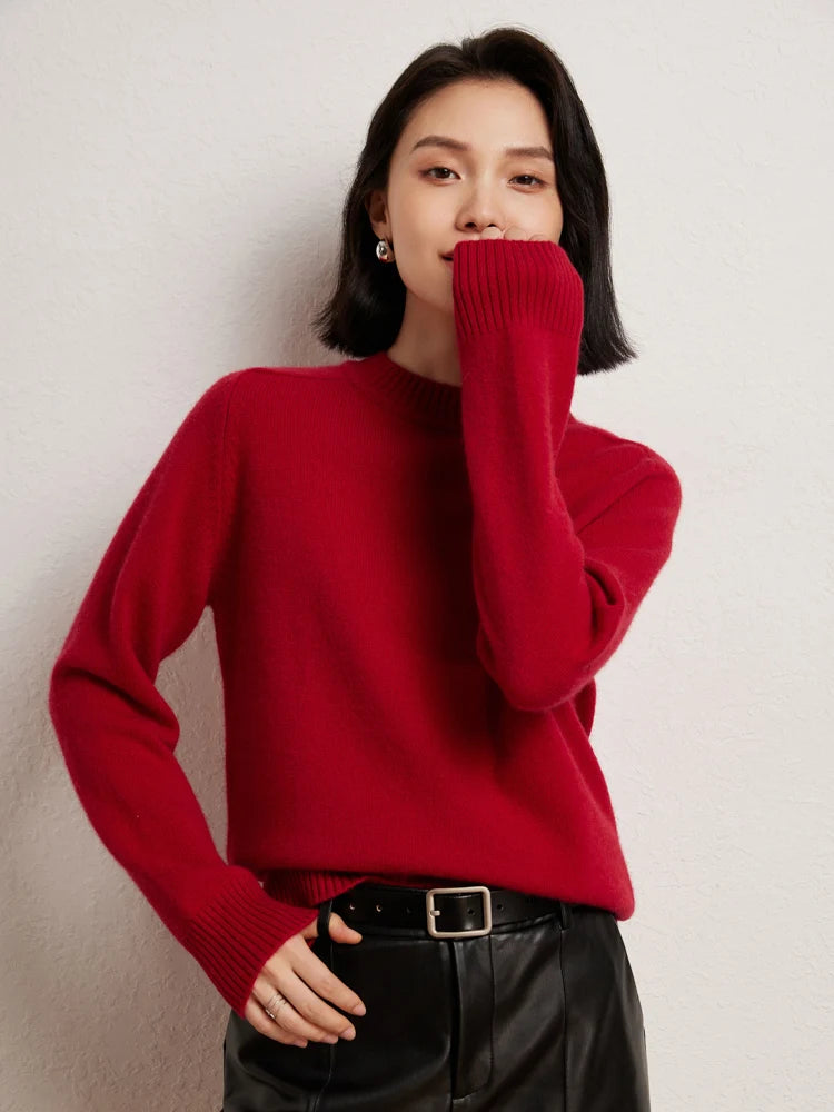 Woman in Red Devil cashmere sweater with hand near face – From Borcelleclothes.