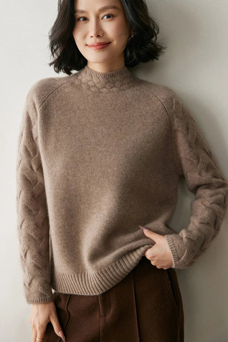 Model in Almond Frost cashmere sweater, leg bent and hand in pocket — From Borcelleclothes.