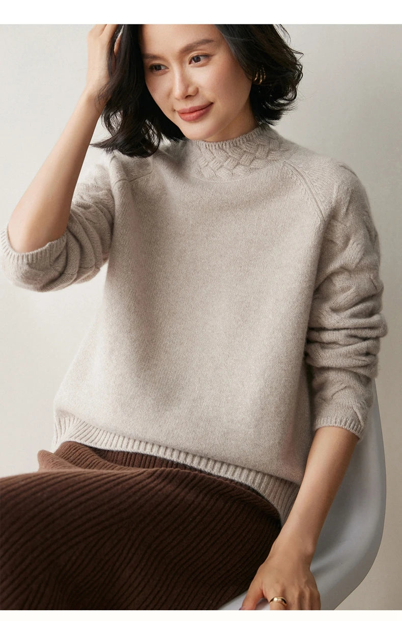 Model in Downy Grey cashmere sweater sitting in chair — From Borcelleclothes.