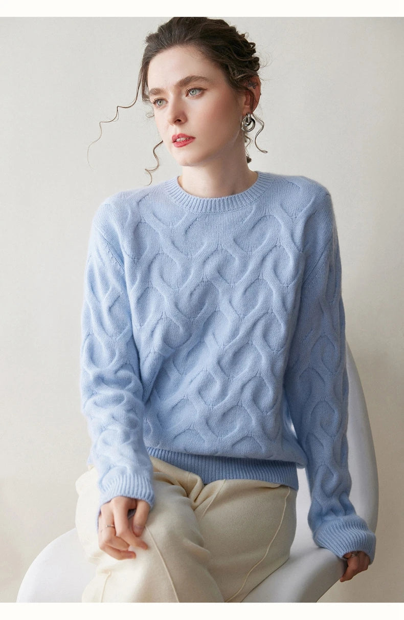 Model sitting on a chair in Forget Me Not cashmere sweater, capturing the calm drape and delicate hue — From Borcelleclothes.