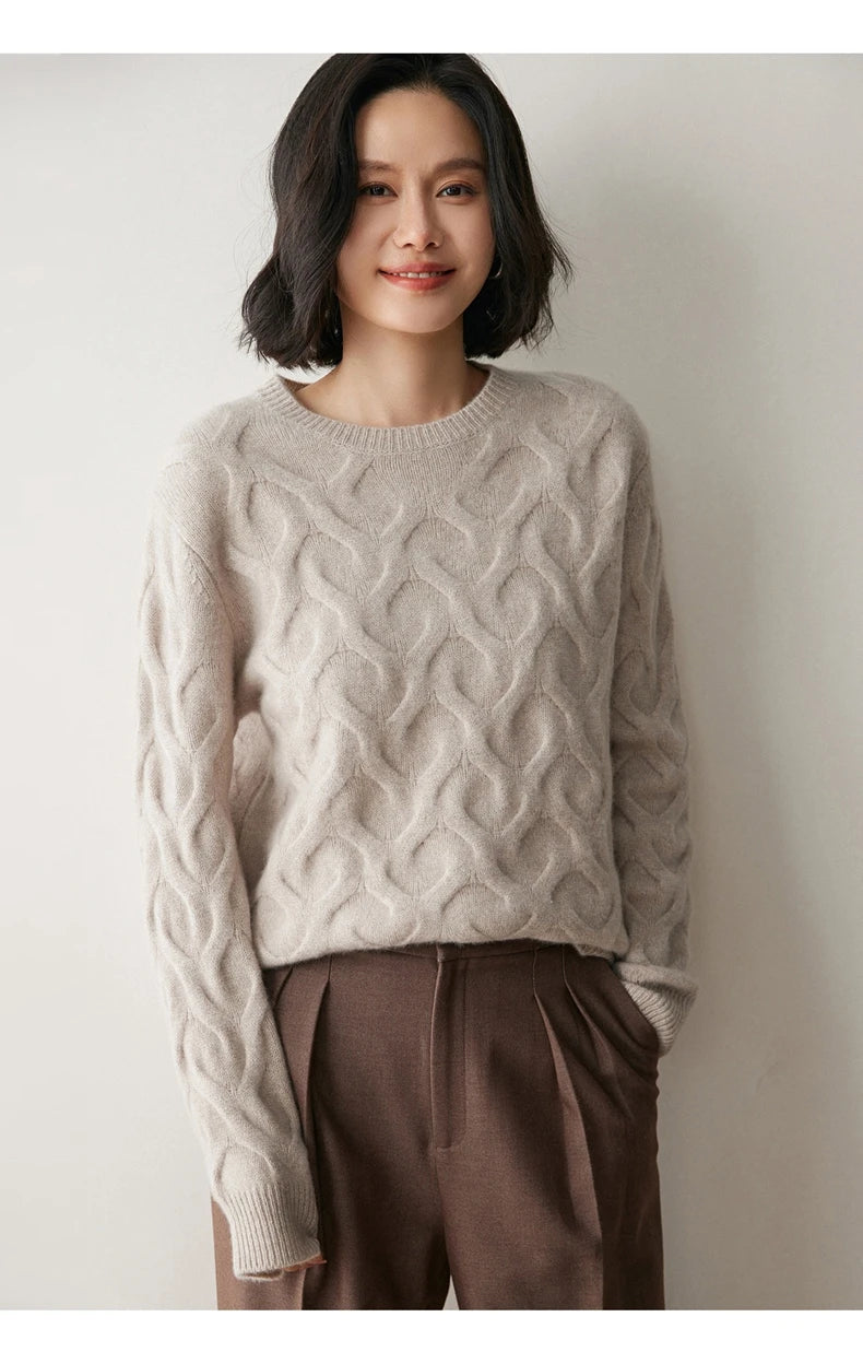 Model resting hand in pocket while wearing Silver Pink cashmere sweater with subtle heart motif — From Borcelleclothes.