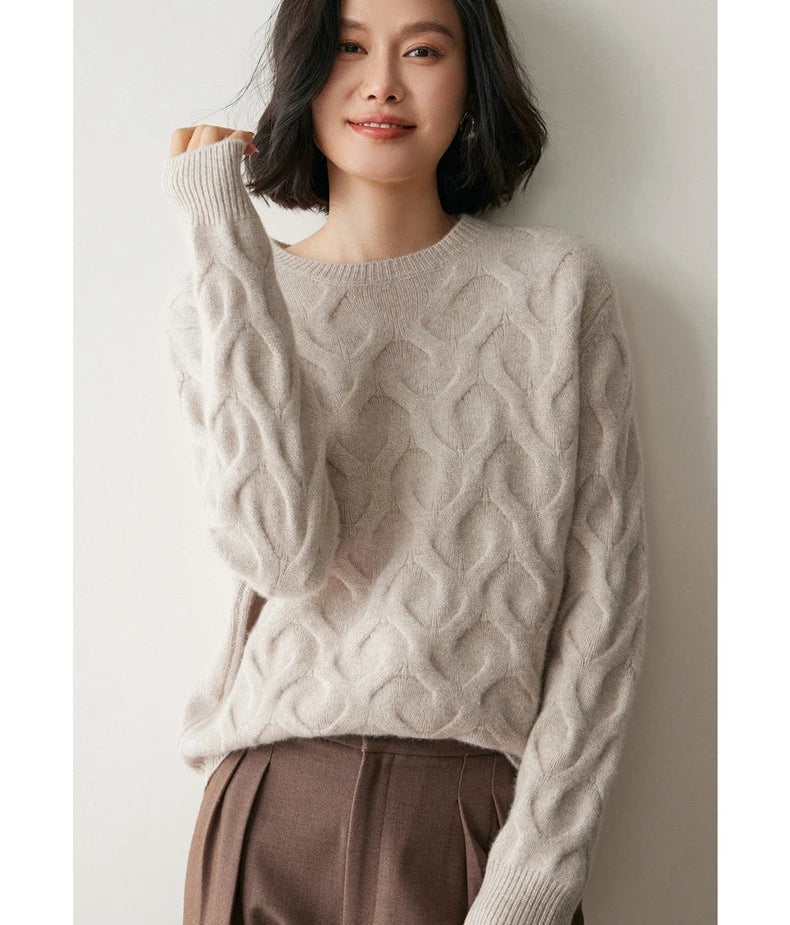 Model in Silver Pink cashmere sweater with one arm raised, revealing the fluid stockinet drape — From Borcelleclothes.