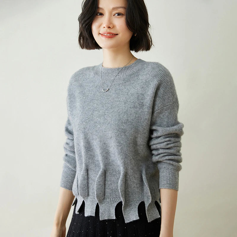 Women’s cashmere sweater in Oslo Grey, with staggered seam construction and sculptural flounces — From Borcelleclothes.