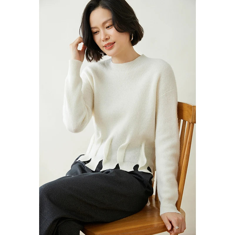 Women’s cashmere sweater in Pearl Bush, with staggered seam construction and sculptural flounces — From Borcelleclothes.