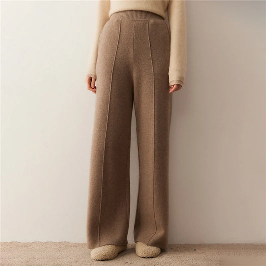 Women's Cashmere trousers in Pastel Brown, with tuck detail, hidden side pockets, and a ribbed waistband — From Borcelleclothes.