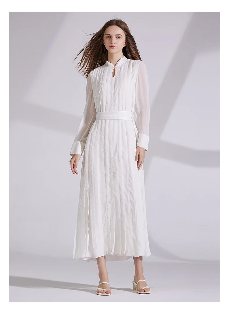 Model wearing only the chiffon silk dress in Whisper color, standing with arms relaxed at her sides. From Borcelleclothes.