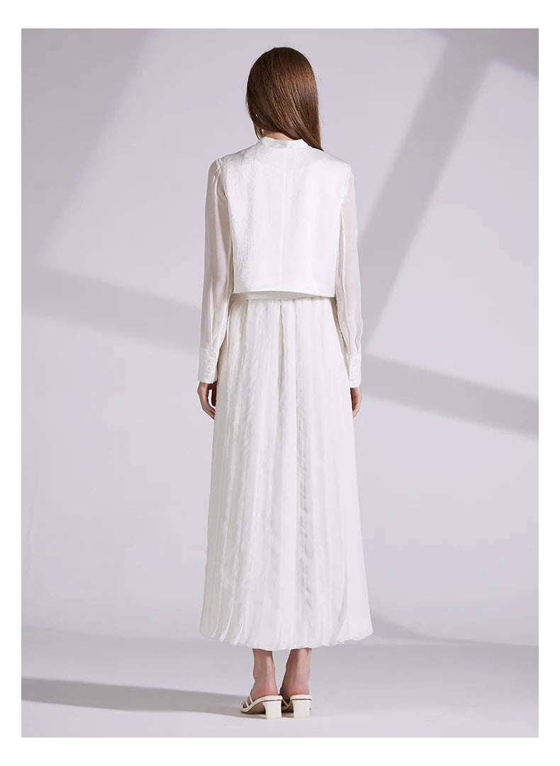 Back view of the full ensemble, highlighting the high-low hem of the jacquard vest. From Borcelleclothes.