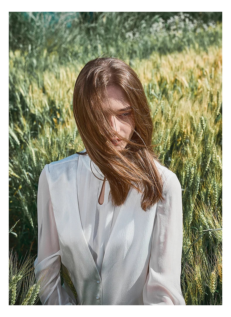 Model in full ensemble seated on the grass. From Borcelleclothes.