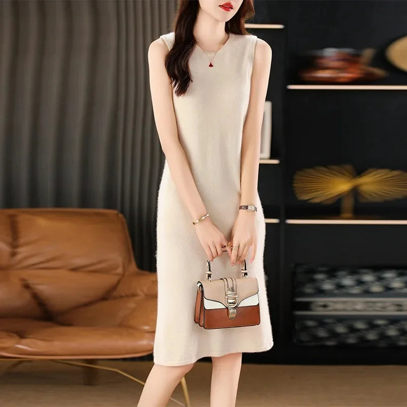 Women's Classic Minimalism Wool Dress in Almond. A timeless knee-length wool dress inspired by Coco Chanel, featuring a sleek silhouette, delicate wool bands, and a discreet back slit for effortless elegance. From Borcelleclothes.