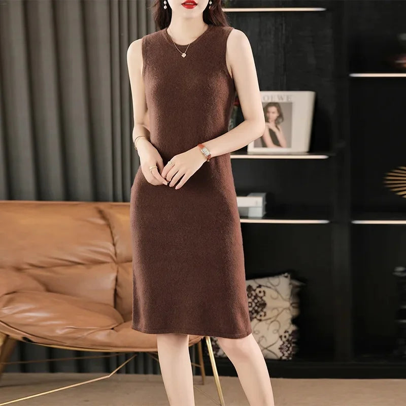 Women's Classic Minimalism Wool Dress in Cafe Noir. A timeless knee-length wool dress inspired by Coco Chanel, featuring a sleek silhouette, delicate wool bands, and a discreet back slit for effortless elegance. From Borcelleclothes.