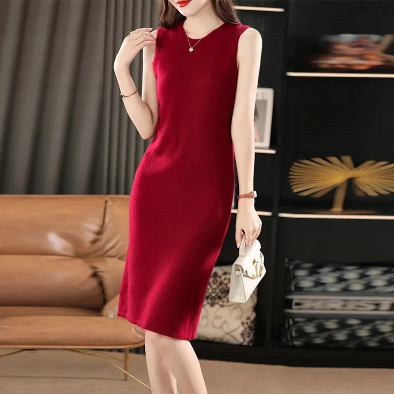 Women's Classic Minimalism Wool Dress in Claret. A timeless knee-length wool dress inspired by Coco Chanel, featuring a sleek silhouette, delicate wool bands, and a discreet back slit for effortless elegance. From Borcelleclothes.