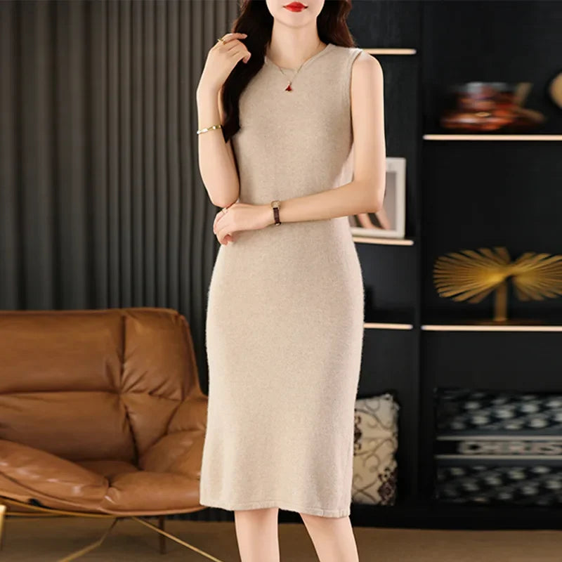 Woman in a Vanilla wool dress with one bent arm. From Borcelleclothes.