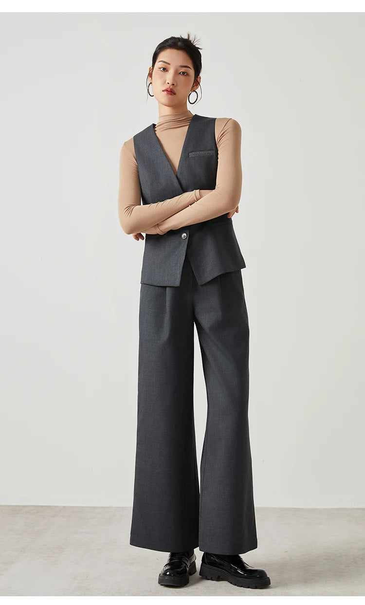 Woman in Davy Grey Classical V-neckline vest, posing with crossed arms — From Borcelleclothes.