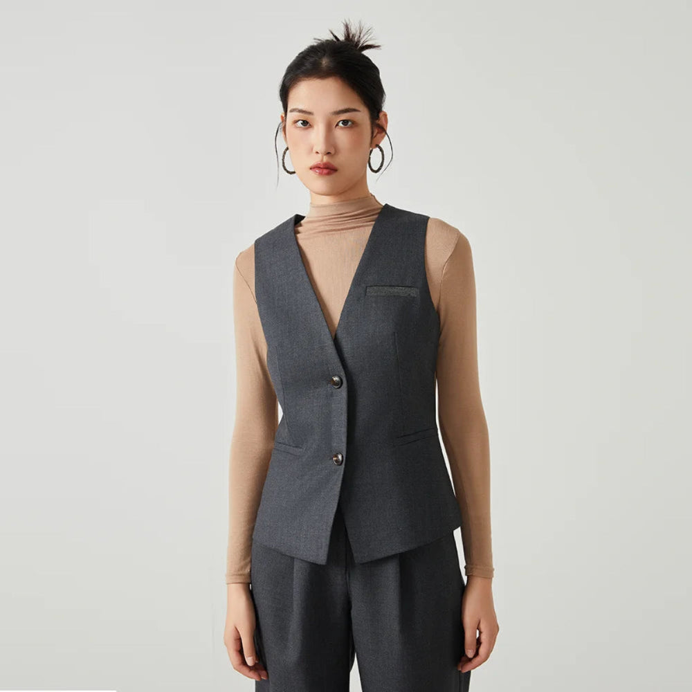 Women’s classical V-neckline vest in Davy Grey with contrast panels, welt pockets, and rhinestone fringe trim — From Borcelleclothes.