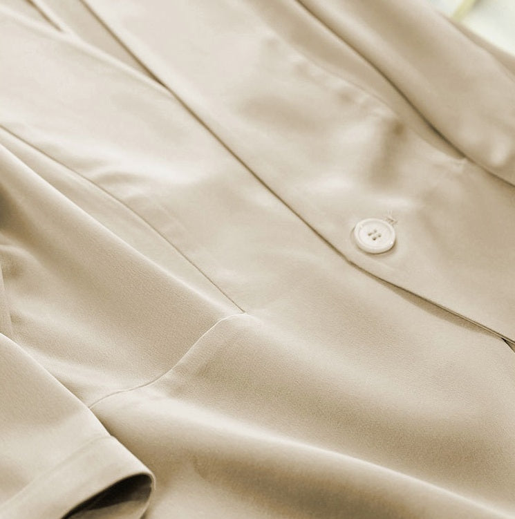 Middle section of the Pearl Bush jacket — rectangular front structure softly giving way to curved lower panels. From Borcelleclothes.