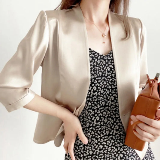 Women’s collarless Mulberry silk jacket in Pearl Bush — a structured yet fluid silhouette with architectural front panels and an open neckline that invites styling freedom. From Borcelleclothes.