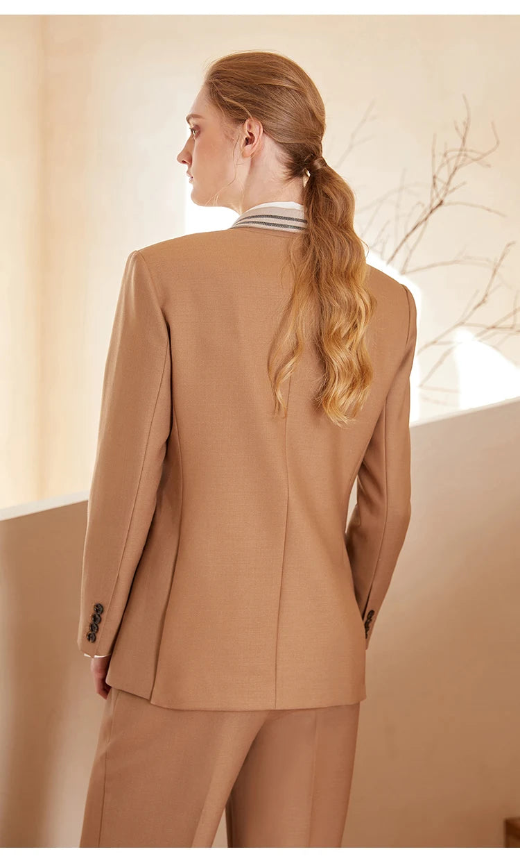 Back view of French Beige contrast-collar wool blazer, showing double vents — From Borcelleclothes.