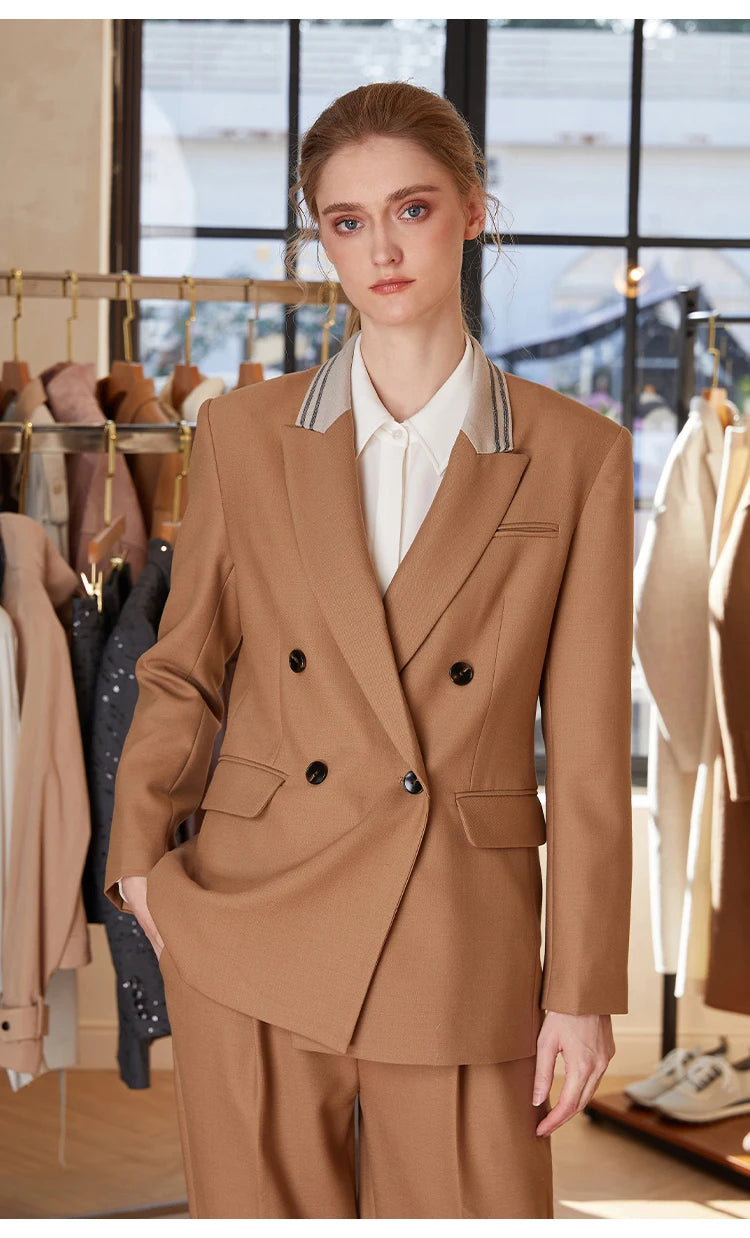 Woman in French Beige contrast-collar wool blazer, hand resting in pants pocket — From Borcelleclothes.