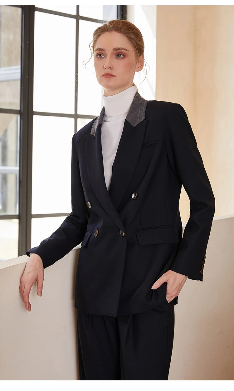 Woman in Mirage contrast-collar wool blazer, arm resting on a white staircase — From Borcelleclothes.