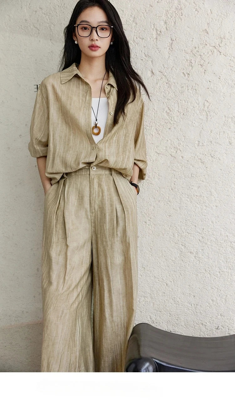 Model with hands in trouser pockets, showing relaxed fit and fluid silhouette. From Borcelleclothes.