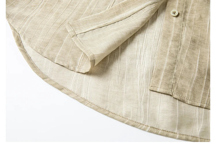 Focus on the hem of the crinkled shirt, highlighting its craftmanship. From Borcelleclothes.