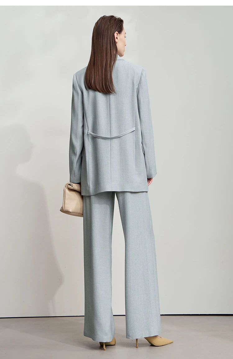 Back view of women’s Morning Blue crinkled viscose blazer – From Borcelleclothes.