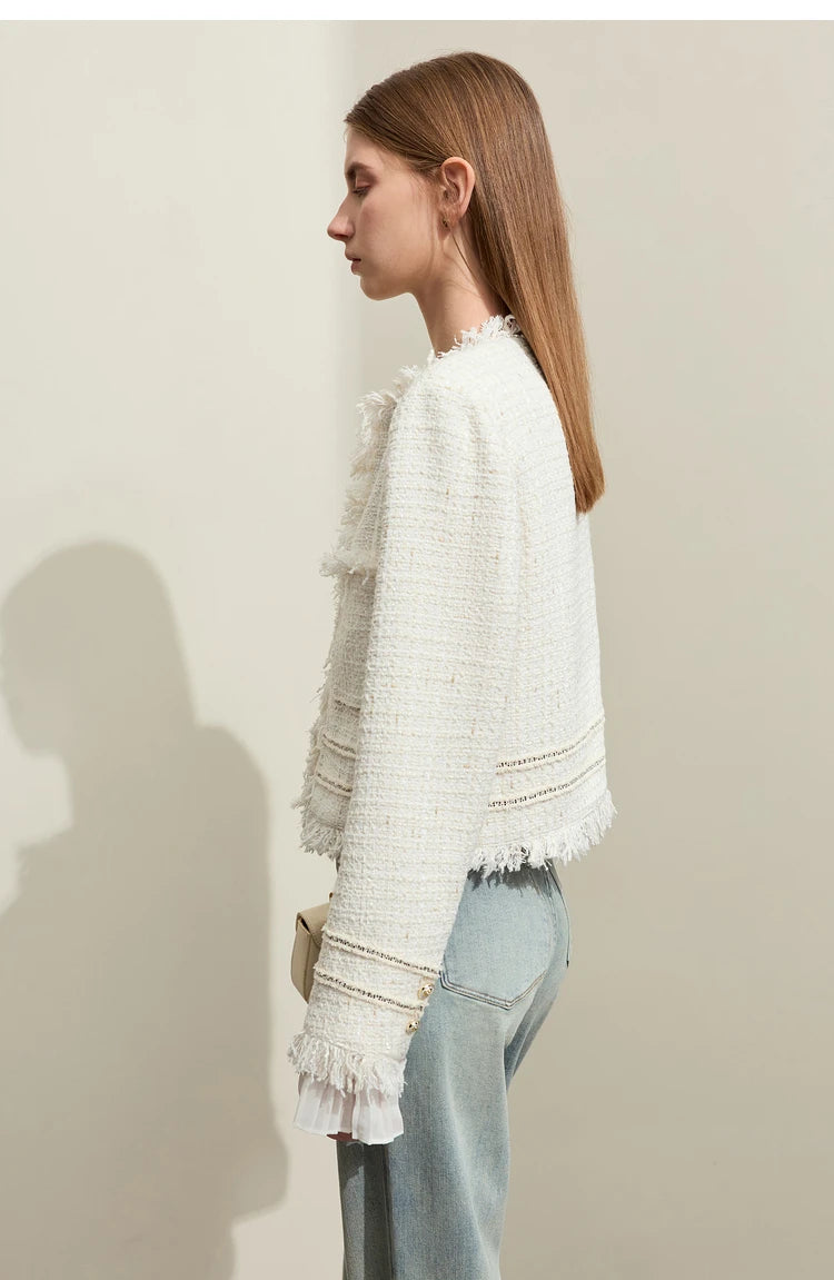 Model wearing Platinum cropped tweed jacket with sheer cuffs, left side view – From Borcelleclothes.