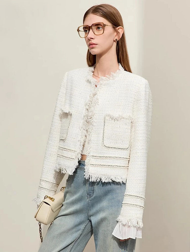 Model wearing Platinum cropped tweed jacket with sheer cuffs, turned slightly side – From Borcelleclothes.