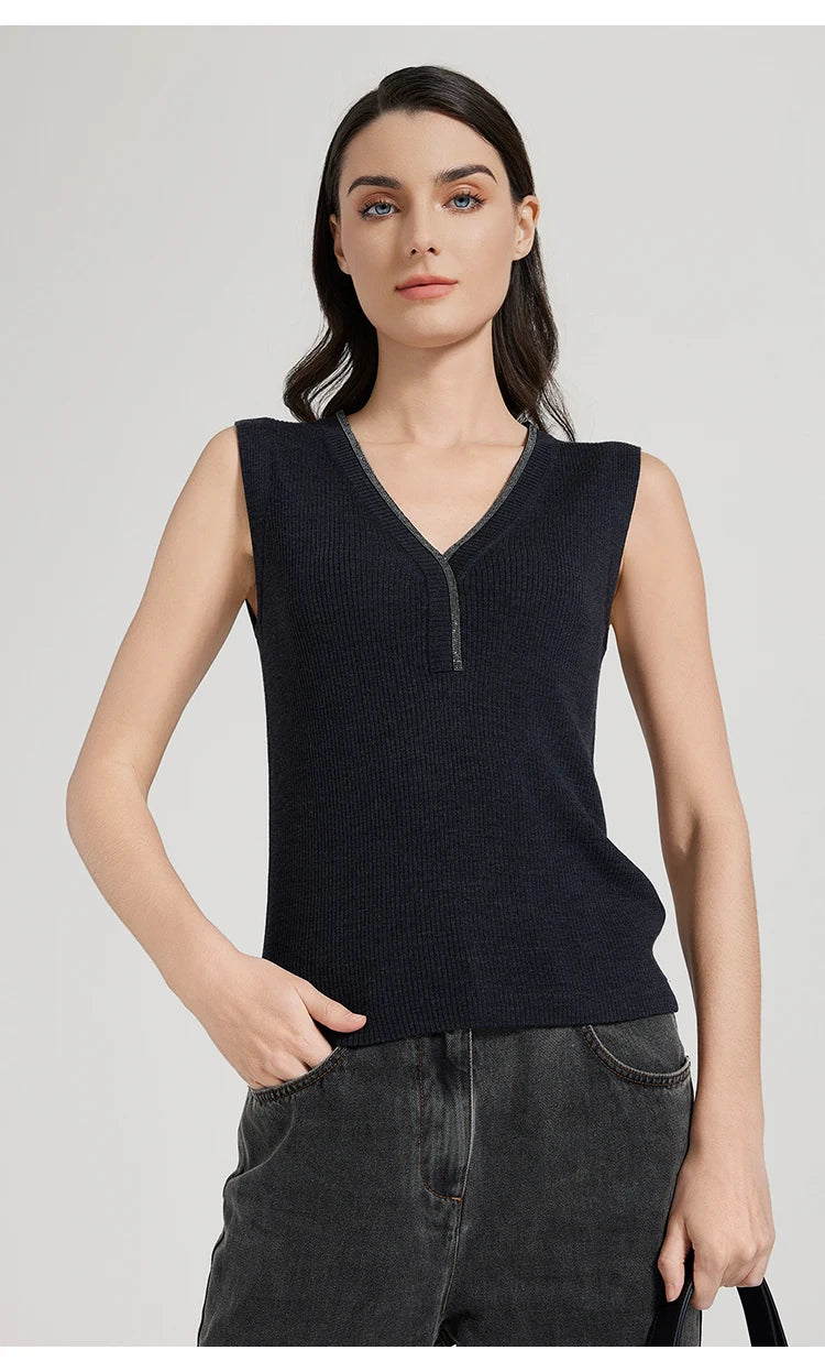 Model in Black Pearl top with one hand resting in pants pocket, emphasizing relaxed styling. From Borcelleclothes.