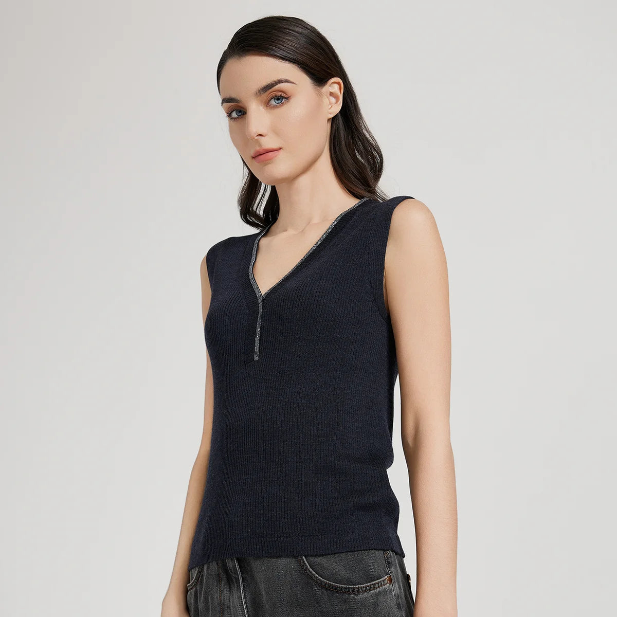 Model in Black Pearl ribbed top turned slightly to the right, showing neckline curve and shoulder. From Borcelleclothes.