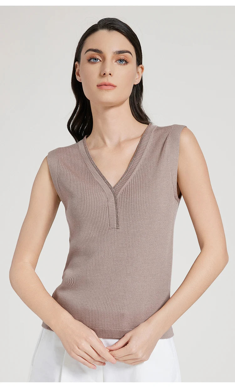 Model in Martini ribbed top gently holding hands in front, showing front silhouette. From Borcelleclothes.