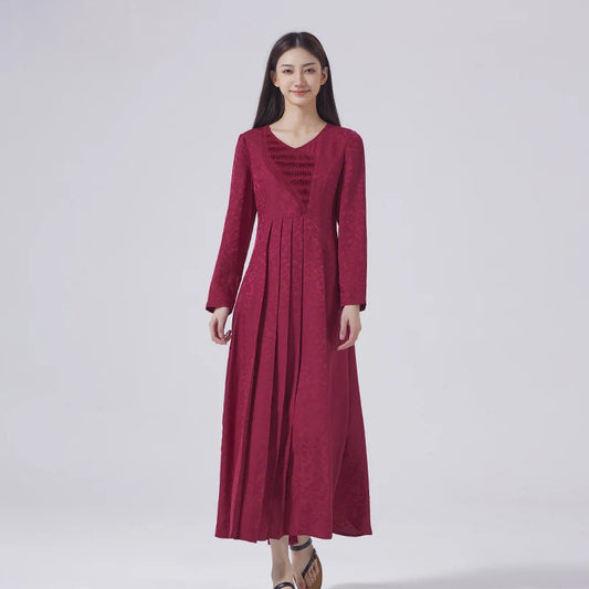 Women's dark raspberry jacquard silk dress with asymmetrical tucked appliqué and concealed knife pleats at front and back. From Borcelleclothes.