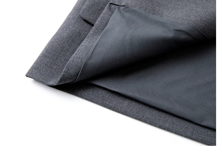 Bottom view of women’s Davy Grey double-breasted blazer with unfolded hem, showcasing shortened length. From Borcelleclothes.