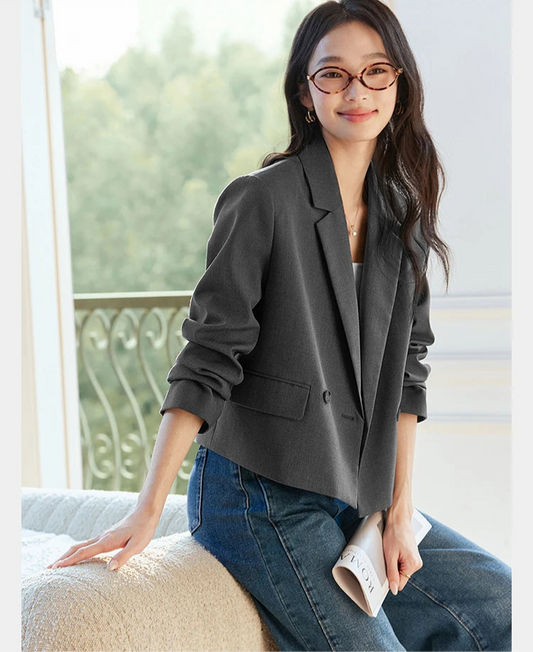 Women's Davy Grey double-breasted blazer with shortened silhouette, notch lapels, and flap pockets. From Borcelleclothes.