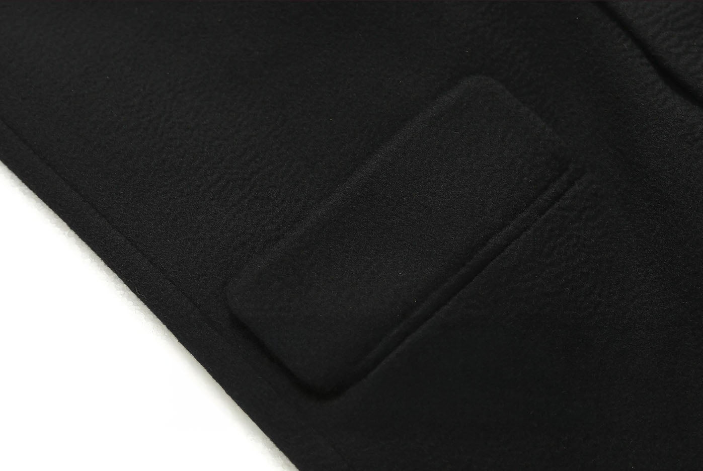 Side flap pocket detail on the Onyx double-breasted cashmere wool coat. From Borcelleclothes.