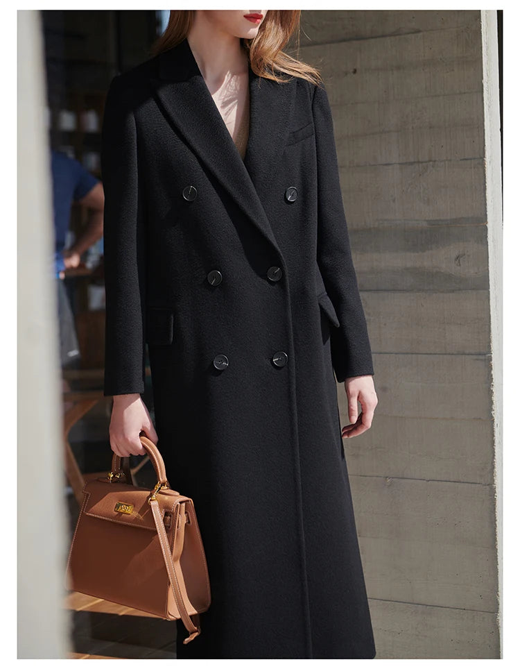 Model standing straight in the Onyx coat, showcasing full length and silhouette. From Borcelleclothes.
