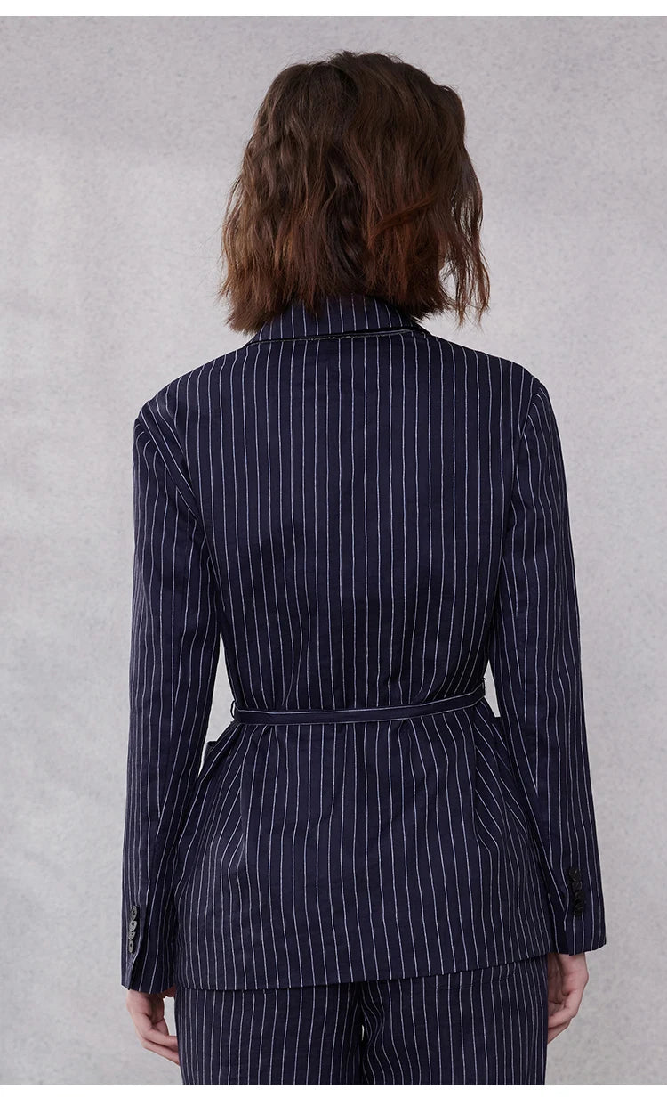 Back view of Mirage blue double-breasted ramie blazer with wide stripes and waist belt detail – From Borcelleclothes.