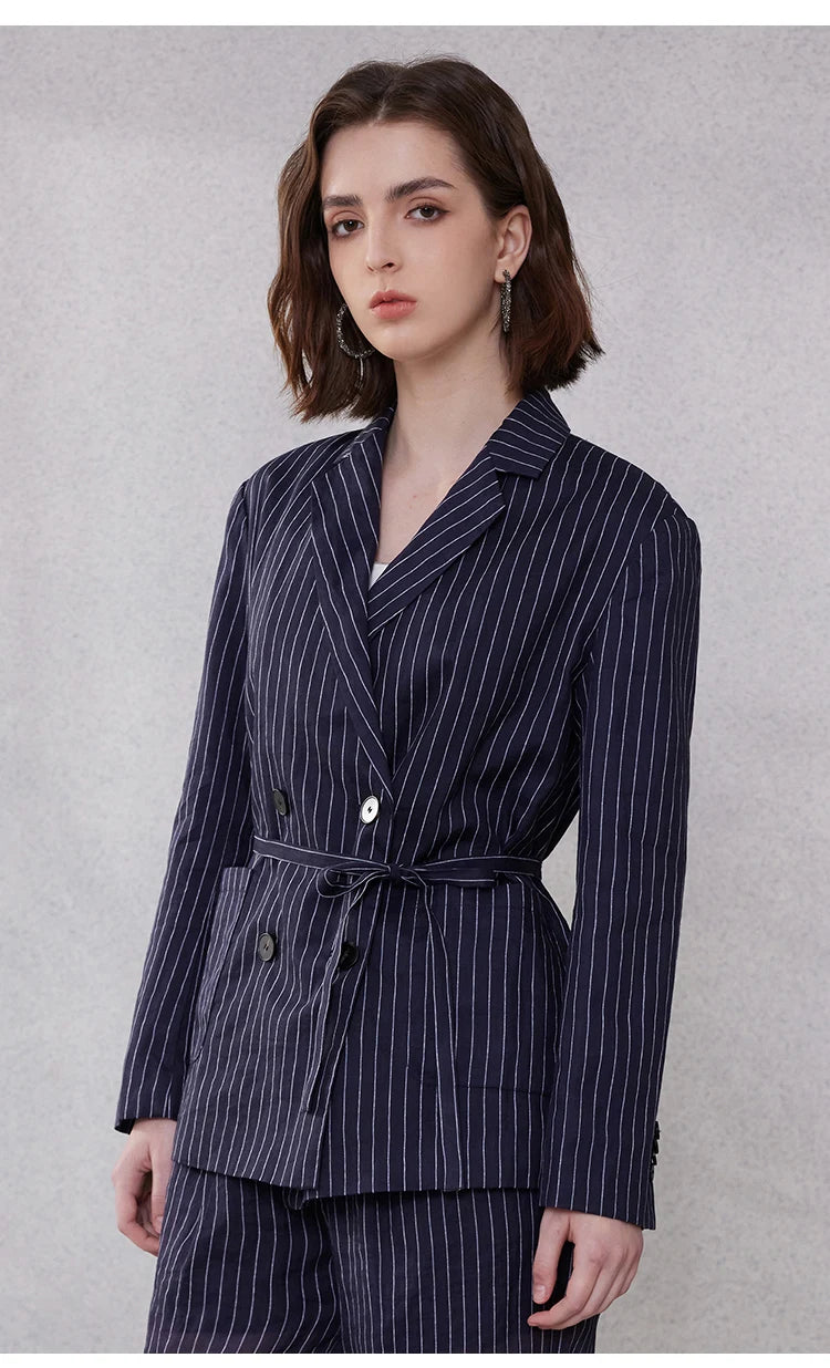 Mirage blue striped ramie blazer, model turned slightly to the side, highlighting structured shoulders and belted waist – From Borcelleclothes.