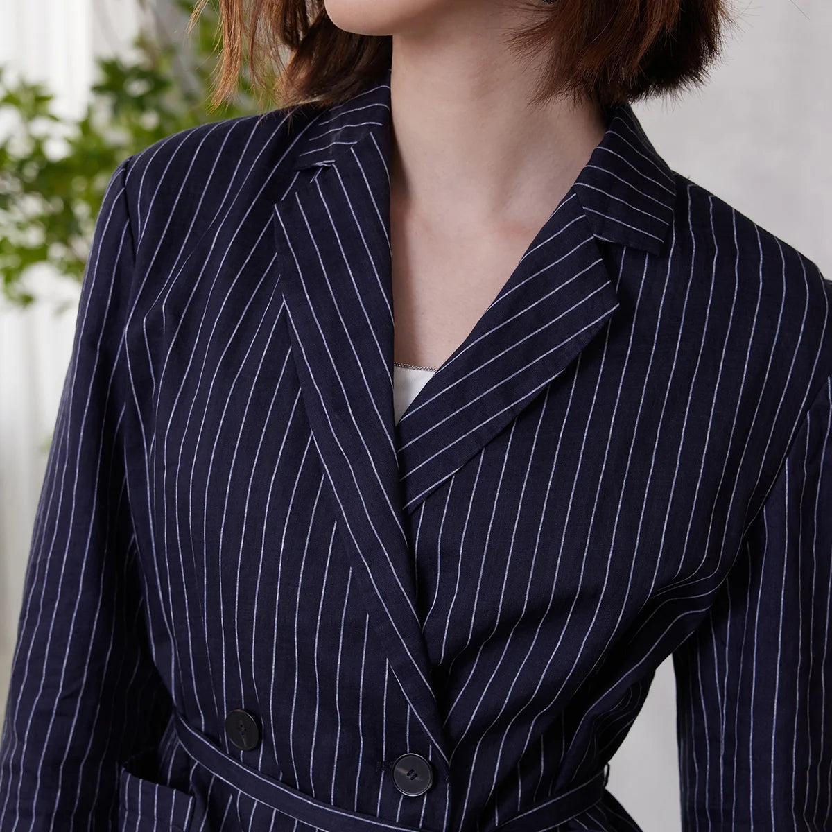 Close-up of Mirage blue ramie blazer, double-breasted front with wide stripes and notch lapels, natural luster of fabric – From Borcelleclothes.