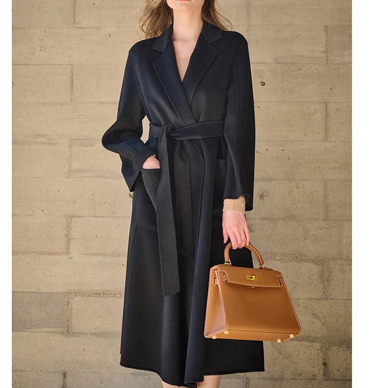 Women's Double-sided cashmere wrap coat in Baltic Sea with notched lapels and patch pockets, secured with a matching belt. From Borcelleclothes.